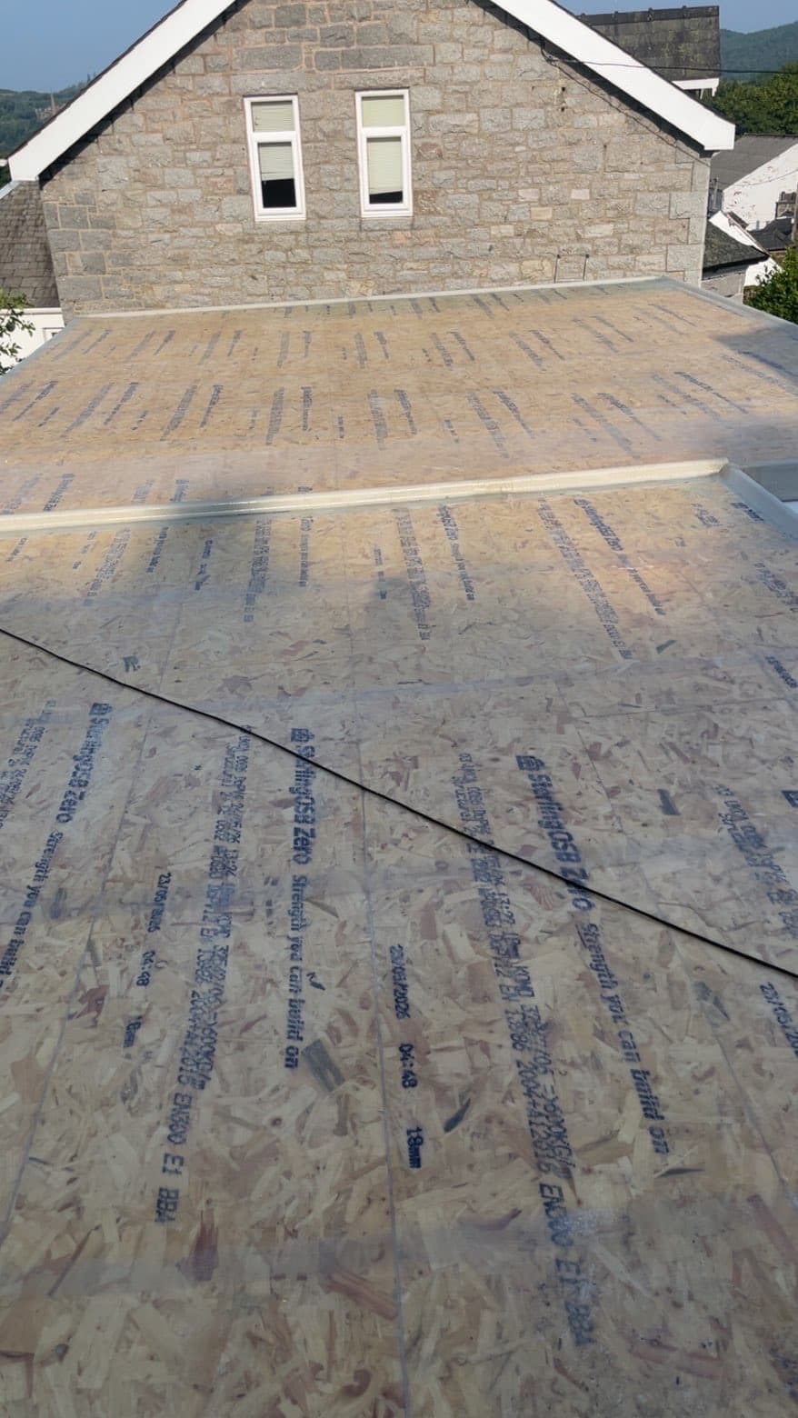 New OSB deck laid ahead of the waterproof flat roof system