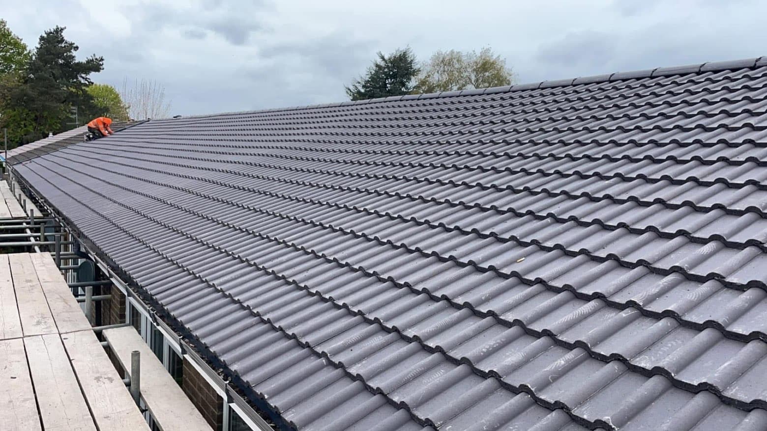 Close-up of neat rows of new concrete tiles laid by RML Roofing Services
