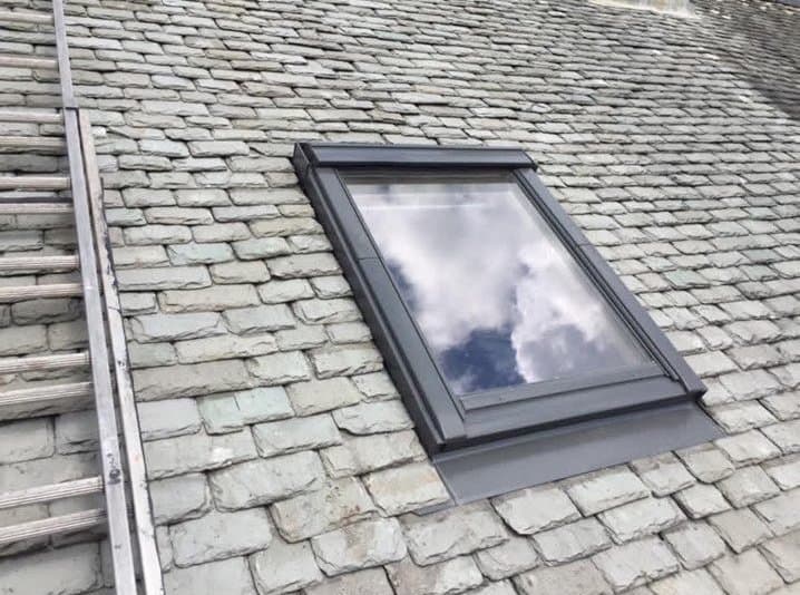 New roof window fitted into an existing slate roof