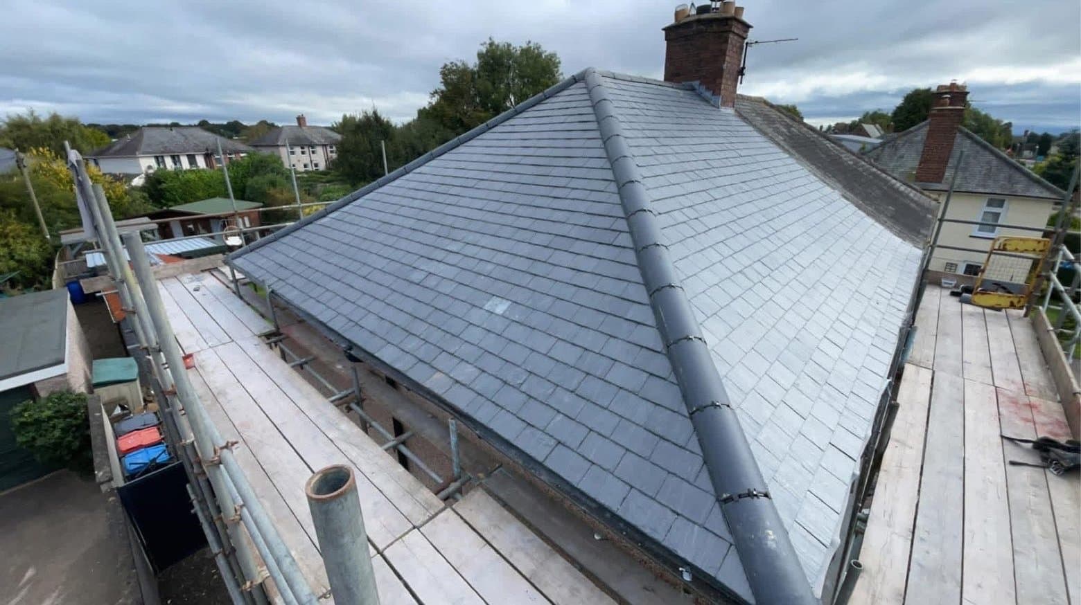 Hipped slate re-roof and rebuilt chimney by RML Roofing Services